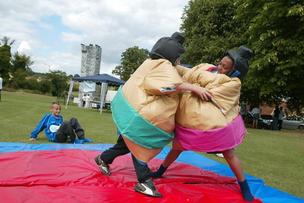Tewkesbury Admag: Example of two people enjoying sumo suit wrestling Tewkesbury Admag: Example of two people enjoying sumo suit wrestling
