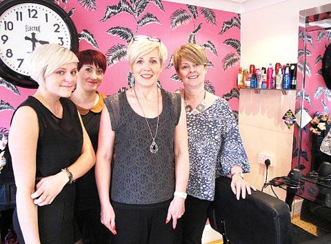 HAPPY AT WORK: Chloe Pearson, left, with members of staff at Contemporary Hair. Chloe is an apprentice at the salon.
