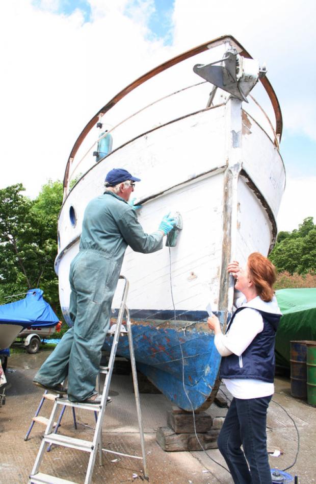 Terry Smith and Jackie Bailey prepare their boat - the Majessa - for Evesham River Festival.