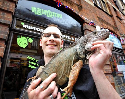 IGUANA: Mark Symonds, proprietor of Rainbow Dragons in Trinity Street, Worcester, with his pet Spike. Picture by John Anyon. 24061502