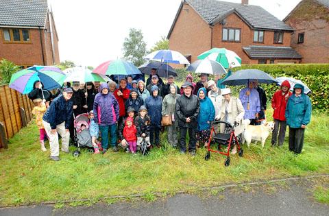Tewkesbury Admag: MAKING OUR POINT: Residents of Hyde Lane, Upton-upon-Severn, are fighting a development plan. They are standing where the access will be sited. Tewkesbury Admag: MAKING OUR POINT: Residents of Hyde Lane, Upton-upon-Severn, are fighting a development plan. They are standing where the access will be sited.