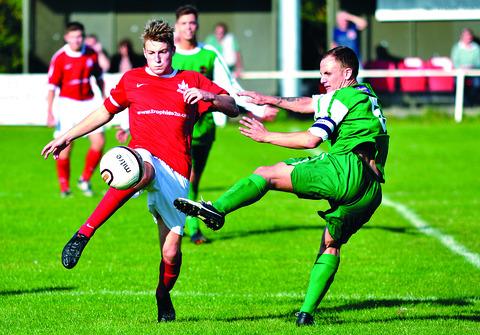 Tewkesbury Admag: A Littleton player (left) tries to win possession during his side’s 1-1 draw with Atherstone Town in the Athium Midland Combination Premier Division on Saturday. Tewkesbury Admag: A Littleton player (left) tries to win possession during his side’s 1-1 draw with Atherstone Town in the Athium Midland Combination Premier Division on Saturday.
