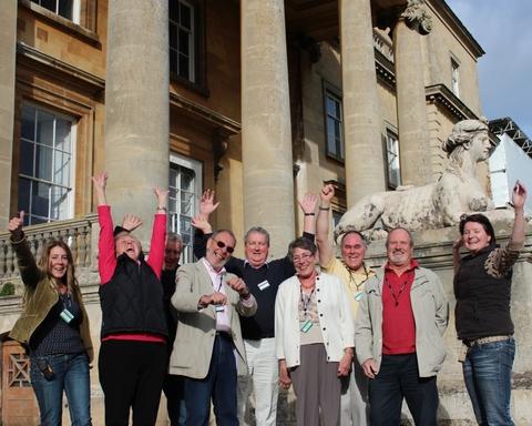 WE DID IT!: Staff and volunteers celebrate news of lottery funding outside Croome Court. Photograph by Richard Higgs.