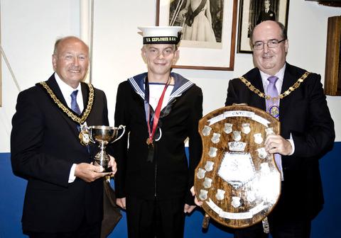 PRIZE GUY: Daniel Ludlow (middle) is congratulated on his Sea Cadet Windsurfing title by councillors Robert Adams (left) and Richard Morris. Picture: RUPERT SEGAR