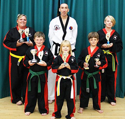 TIGERS ROAR: White Tiger Tae Kwon-Do and Self Defence Club members line up after trophy success. Back row (from left): Sarah Boden, Paul Wanklyn and Gemma Ranford. Middle: Jake Boden and Bradley Boden. Front: Ruby Keen.