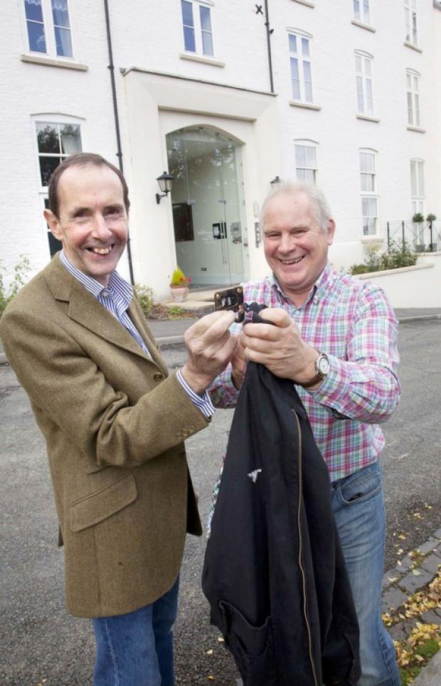 REUNITED: from left, John Rudge, the director of FRD Associates, presents former Wells House head boy Richard Snell with his peg.