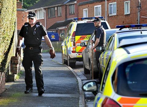 MURDER INQUIRY: Police at the scene of the killing in Teme Road, Worcester