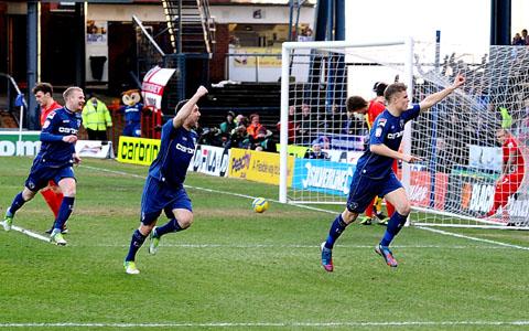 MATT’S MY BOY: Former King’s School pupil Matt Smith, of Evesham, centre, celebrates the first of his two goals for Oldham Athletic that helped dump Liverpool out of the FA Cup.