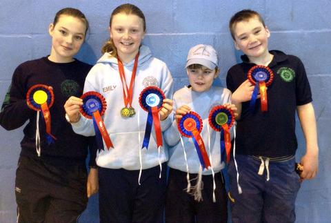 ALL SMILES: Croome Hunt Pony club members Emily Turner and Robert Saunders (centre) along with Malvern Pony Club's Eve Eggington (left) and Eddie Eggington (right). Picture supplied by Sara Turner.