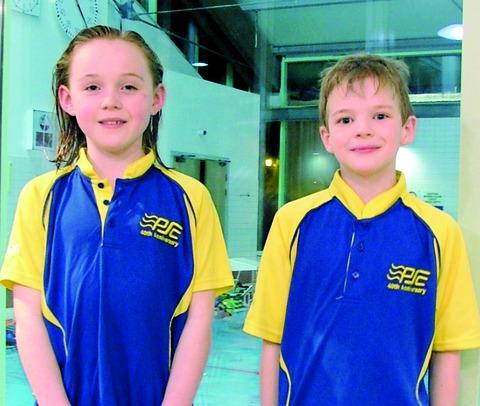 IMPRESSIVE DEBUTS: For Pershore Swimming Club's Hannah Woodcock and Cameron Leech at a development gala held in Redditch. Picture: IAN PUGH
