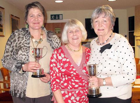 JUST CHAMPION: Pat Catlin and Patsy Brumage receive their trophies from ladies' captain Lesley Kewley (centre). Picture supplied by Angela Fletcher.