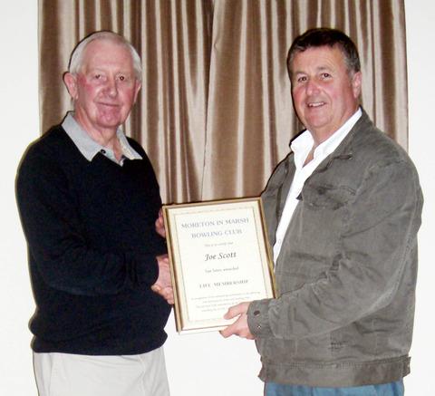 Joe Scott (right) is presented with life membership of Moreton-in-Marsh Bowls Club by chairman David Stanfield. Picture: MIKE WAINWRIGHT.