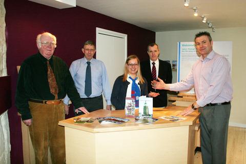 SETTLING IN: Pictured from left, Simon Wilkinson, Upton Heritage centre volunteer; Dave Hawley, Technical Services Manager, MHDC; Jenny Crawford, TIC assistant/staff member; district councillor Phil Grove and John Birbeck, contract manager, Spectus.