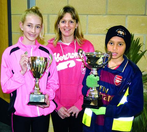 SILVERWARE: Rosie Mutsaars and Dylan Williams receive their trophies from Shona Crombie-Hicks (centre). Picture: RICHARD BUFTON