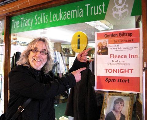 CONCERT: Gordon Giltrap with a poster advertising his gig at the Fleece pub.