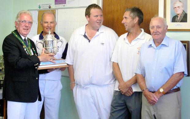 Tewkesbury Admag: COUNTY WINNERS: President Ken Bick (left) presents the fours winners’ trophy to Broadway at the Worcestershire Association finals. Picture: DAVID HILL Tewkesbury Admag: COUNTY WINNERS: President Ken Bick (left) presents the fours winners’ trophy to Broadway at the Worcestershire Association finals. Picture: DAVID HILL