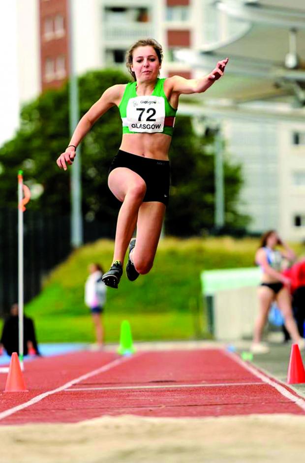 Tewkesbury Admag: LEAP OF FAITH: Sixth-placed Georgie Greenwood tackles the triple jump at the Scottish Senior Championships. Tewkesbury Admag: LEAP OF FAITH: Sixth-placed Georgie Greenwood tackles the triple jump at the Scottish Senior Championships.