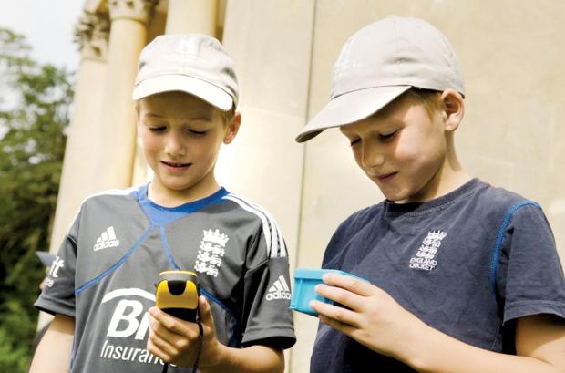 HAVING A GO: Oliver and Joel Cox from Bidford-on-Avon try out geocaching at Croome Park. Picture by Pam Turner.