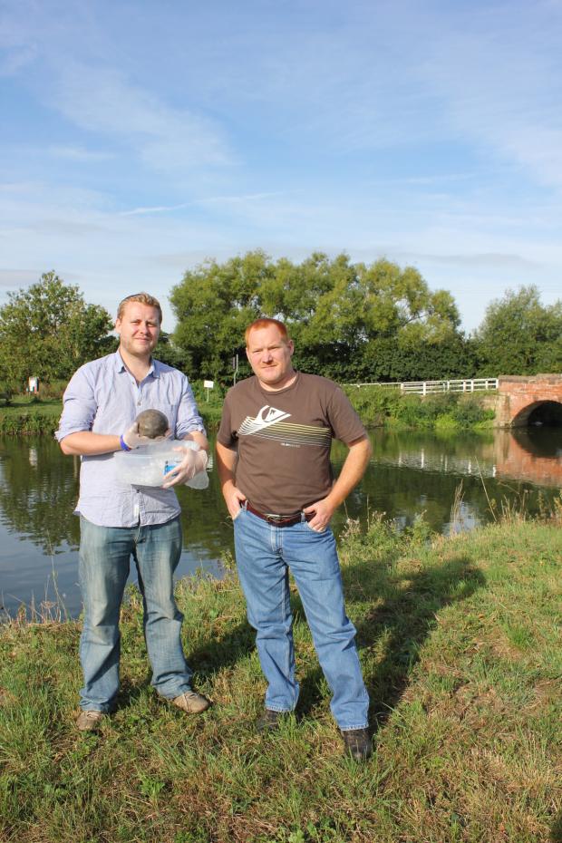 Nick Daffern from Worcestershire Archaeology and Martin Evans with his unusual find at the River Avon