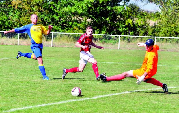 SO CLOSE: Hat-trick hero Jamie Insall beats the goalkeeper but fires just wide in Littleton’s 6-1 thrashing of Castle Vale JKS. Picture: MICHAEL PITTS