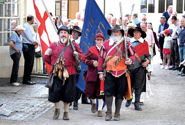 STEPPING OUT FOR HISTORY: Crowds filled the city streets to enjoy the Drumhead Service of Remembrance.