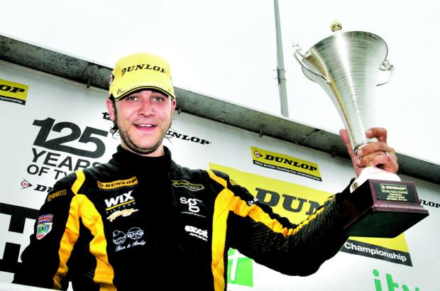 NATIONAL PRIDE: Rob Austin was celebrating after winning the second race at the latest round of the British Touring Car Championships held at Rockingham. Picture: DARREN PRICE
