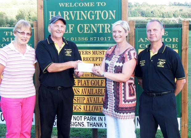 Tewkesbury Admag: FUNDING BOOST: Outgoing Harvington club captain Mick Lewis presents a cheque to Sarah Wakeman, of the Air Ambulance Service, alongside Wendy Byrd, director of Manor Farm Leisure, and Nigel Bambridge, club professional. Picture: JEREMY SAUNDERS. Tewkesbury Admag: FUNDING BOOST: Outgoing Harvington club captain Mick Lewis presents a cheque to Sarah Wakeman, of the Air Ambulance Service, alongside Wendy Byrd, director of Manor Farm Leisure, and Nigel Bambridge, club professional. Picture: JEREMY SAUNDERS.