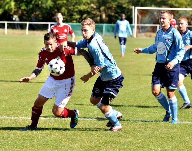 SPOT ON: Littleton’s Stuart Hall (left) scored a penalty in his side’s 3-2 loss to Earlswood in Midland Combination Premier Division on Saturday.