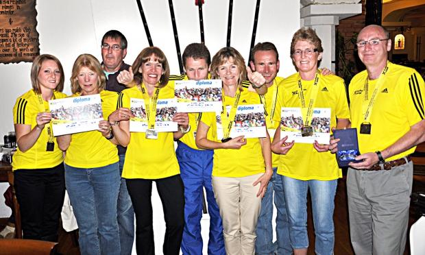 EUROPEAN ADVENTURE: From left: Bourton Roadrunners members Catherine Wheeler, Lynn Hudson, David Pyne, Steph Holton, Ewen Smith, Susan Hunt, Mike Smith, Shirley Creed and Nigel Frith line up for the camera in Bucharest.