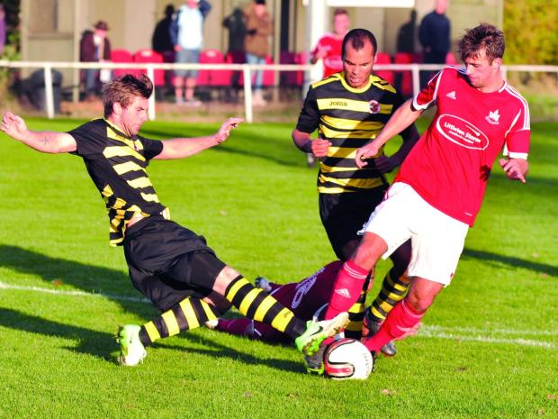 Tewkesbury Admag: ON THE BALL: Kyonn Evans (right) takes on Atherstone. Picture: MICHAEL PITTS Tewkesbury Admag: ON THE BALL: Kyonn Evans (right) takes on Atherstone. Picture: MICHAEL PITTS