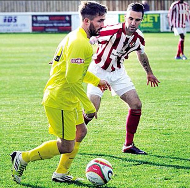Tewkesbury Admag: INJURY SCARE: Simon Fitter (red and white shirt) had to leave the field after taking a blow to his shoulder. Tewkesbury Admag: INJURY SCARE: Simon Fitter (red and white shirt) had to leave the field after taking a blow to his shoulder.