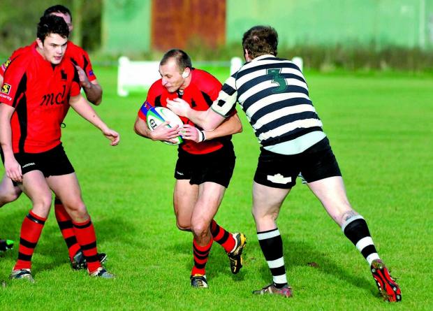 Tewkesbury Admag: RUNNING MAN: Pershore’s Ashley White storms through during his side’s 16-12 defeat to Ledbury in Midlands Three West (South). Tewkesbury Admag: RUNNING MAN: Pershore’s Ashley White storms through during his side’s 16-12 defeat to Ledbury in Midlands Three West (South).