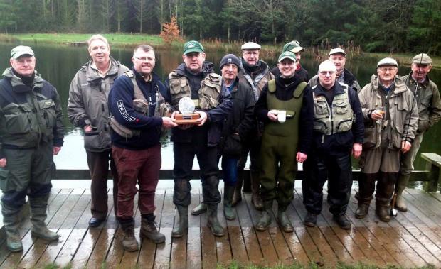 Tewkesbury Admag: ICICLE TEST: Winners Chris Ballard and Jason Malin show off their trophy alongside the other competitors at Lenches Lake. Tewkesbury Admag: ICICLE TEST: Winners Chris Ballard and Jason Malin show off their trophy alongside the other competitors at Lenches Lake.