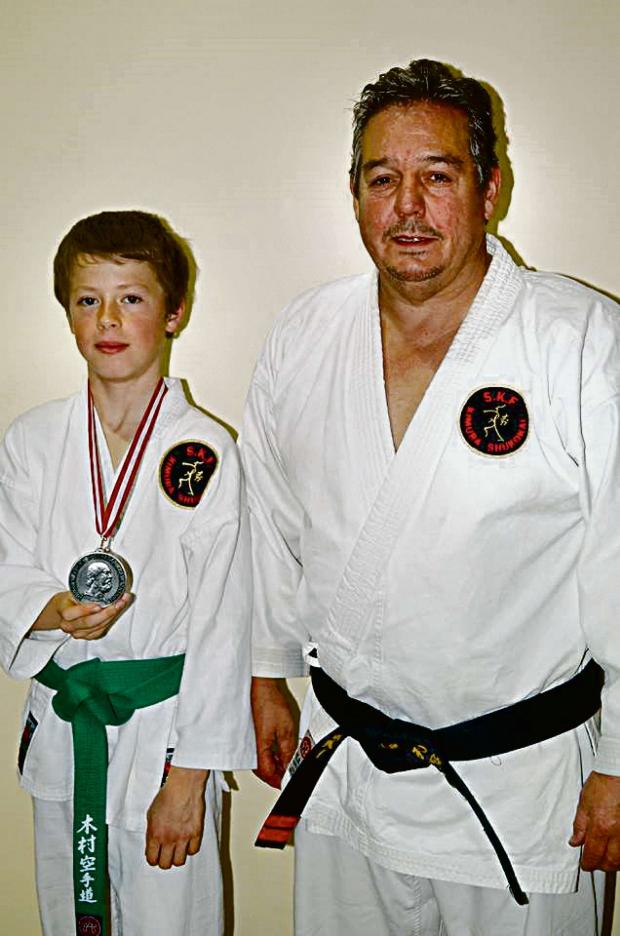 Tewkesbury Admag: MIDLANDS SUCCESS: Karate silver medal winner Kieran Bennett with Sensi Steve Farrow. Picture: DAVID GRAVES. Tewkesbury Admag: MIDLANDS SUCCESS: Karate silver medal winner Kieran Bennett with Sensi Steve Farrow. Picture: DAVID GRAVES.