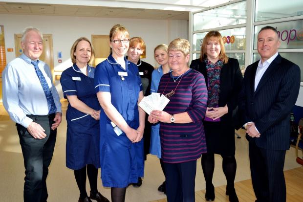 Tewkesbury Admag: Linda Patrick presents her donation to Junior Ward Sister Kerry Burbidge with consultant physician Dr Chris Pycock, specialist nurse Heidi Nunwick, matron Jane Rutter, Matron, staff nurse Rebecca Poile, along with Mr Patrick’s daughter Lyn Goodwin a Tewkesbury Admag: Linda Patrick presents her donation to Junior Ward Sister Kerry Burbidge with consultant physician Dr Chris Pycock, specialist nurse Heidi Nunwick, matron Jane Rutter, Matron, staff nurse Rebecca Poile, along with Mr Patrick’s daughter Lyn Goodwin a