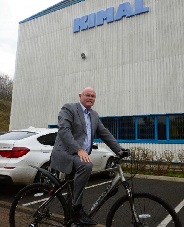 Tewkesbury Admag: Kimal Plc managing director Mark Pettitt gets on his bike Tewkesbury Admag: Kimal Plc managing director Mark Pettitt gets on his bike