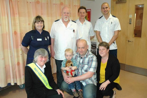 Tewkesbury Admag: (Back L-R) Worcestershire Royal Hospital matron Glenis Adams, specialist nurse practitioner Pete James, care support worker Andy Wilce and clinical nurse specialist Tom Rees. (Front L-R) Sue Sollis with Antony Fessey, his son Oliver and wife Donna. Tewkesbury Admag: (Back L-R) Worcestershire Royal Hospital matron Glenis Adams, specialist nurse practitioner Pete James, care support worker Andy Wilce and clinical nurse specialist Tom Rees. (Front L-R) Sue Sollis with Antony Fessey, his son Oliver and wife Donna.