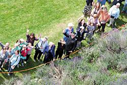 Some of the thousand or so people who ringed Tewkesbury Abbey to mark the first anniversary of the floods