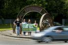 Campaigners for Yes stand at the Three Pennies Lifford roundabout (Liam McBurney/PA)