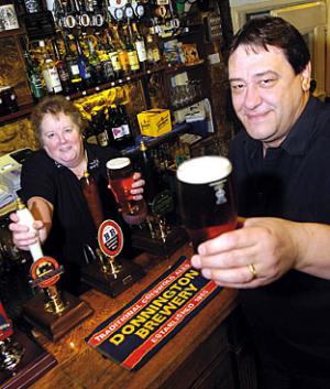 4 Here’s to local real ale: Sally and Ray Mayo, landlady and landlord at the Baker’s Arms at Broad Campden, sample one of the local brews. 05jan09066b